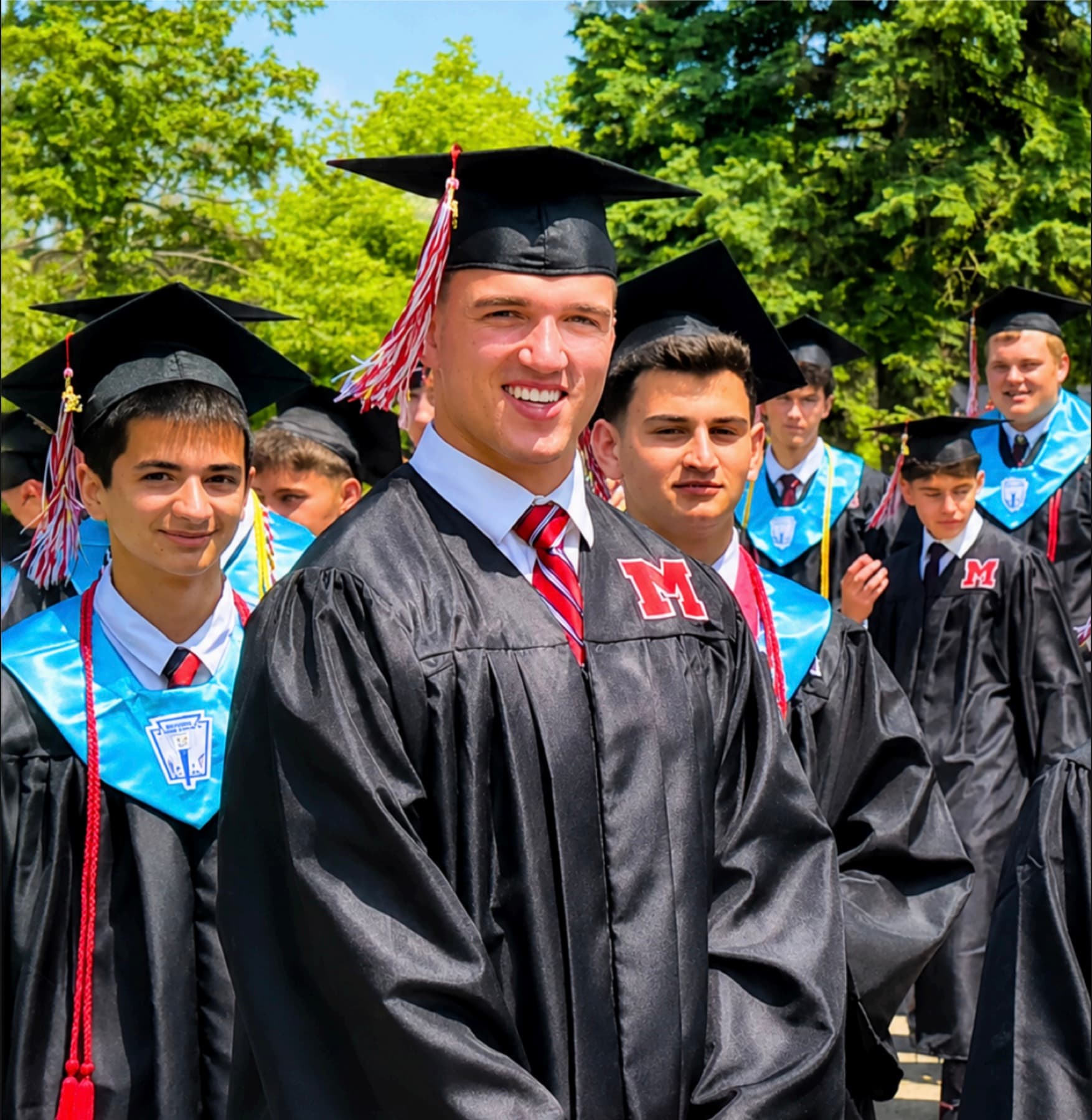 St. Mary’s Class of 2026 graduates gathered outdoors in caps and gowns