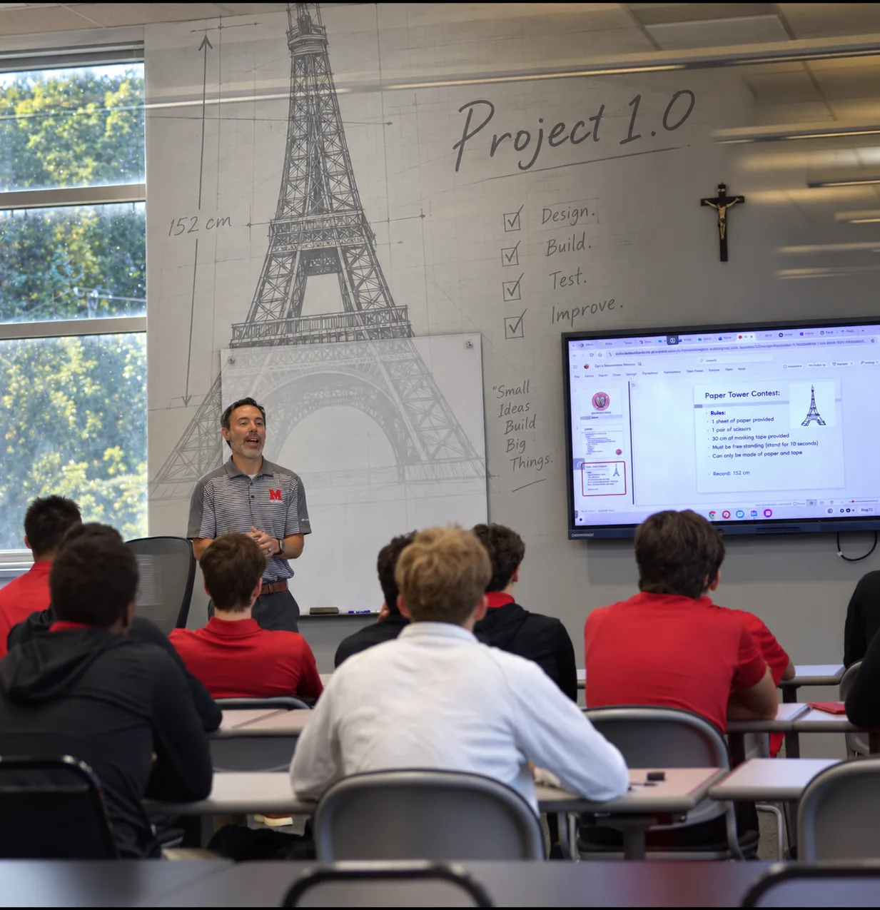 A physics and engineering teacher leading students through a classroom design challenge