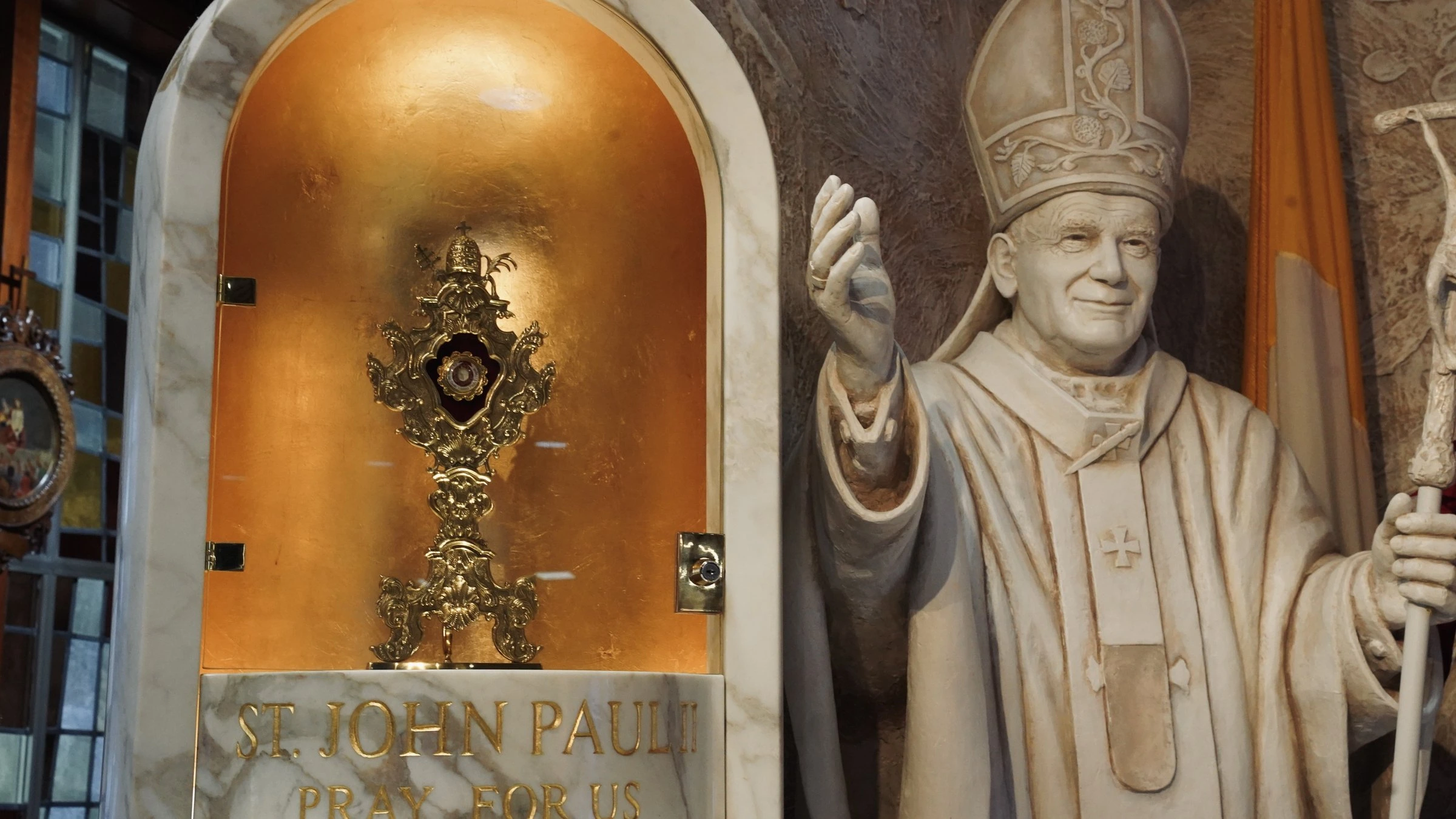 The reliquary and statue of Saint John Paul II in the Shrine at Orchard Lake